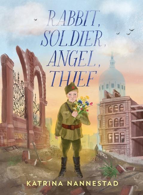 A young boy in an army uniform stands near broken buildings in a battlefield holding a bunch of flowers. Rabbit, Soldier, Angel Thief by Katrina Nannestad.